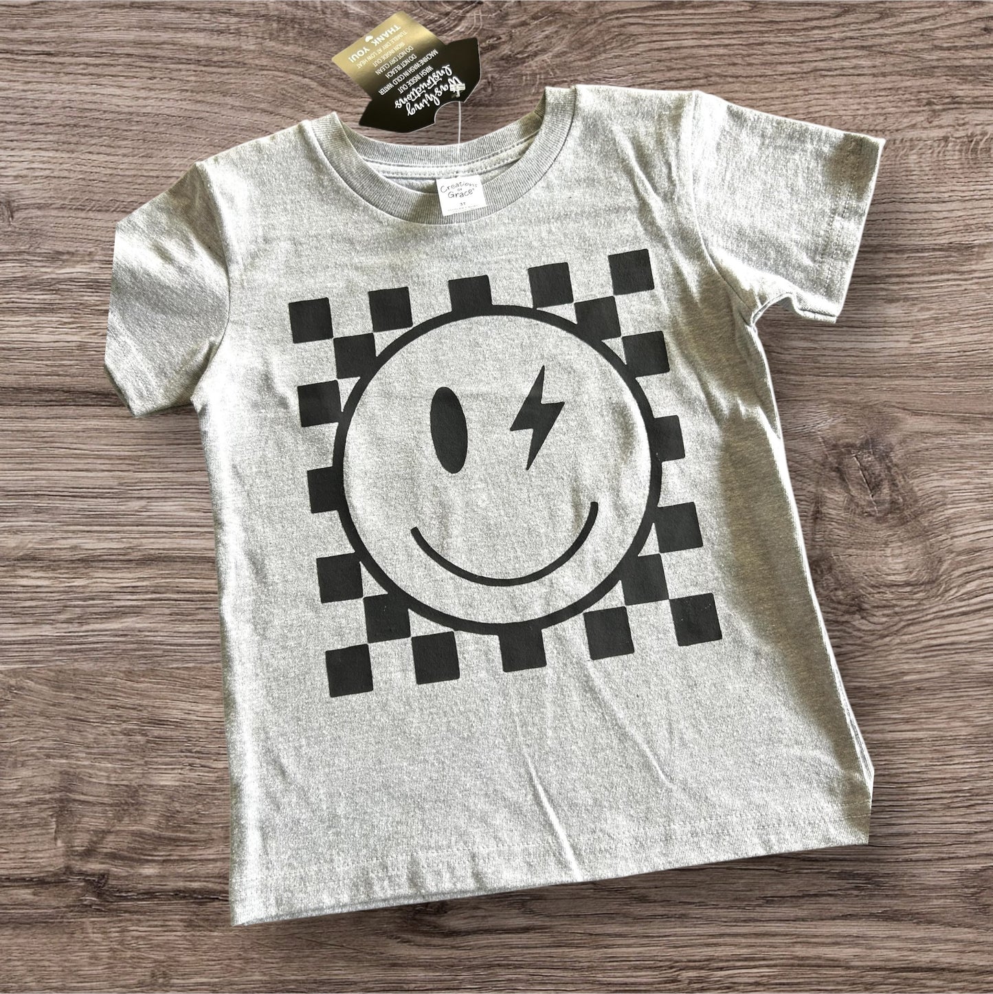 Smiley Face and Checker Background Toddler Tee